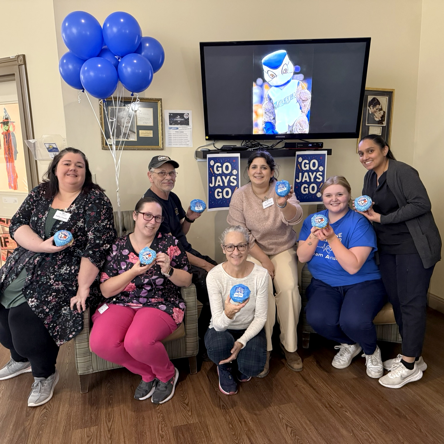 Atrium Retirement Residence team members celebrating together on Blue Jays day, showing their community spirit and friendly workplace culture